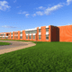 school building with healthy grass